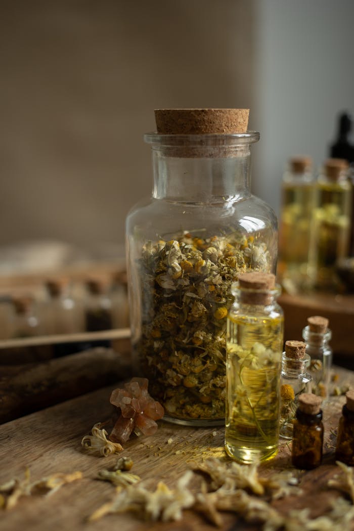 ours-journey A rustic composition featuring vintage jars with dried herbs and essential oils, perfect for wellness themes.